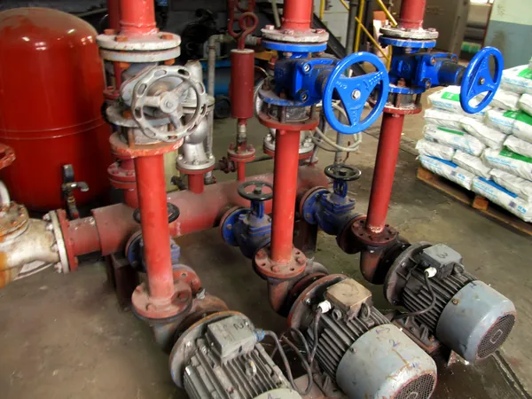 Valves with blue handles and old pumps embedded