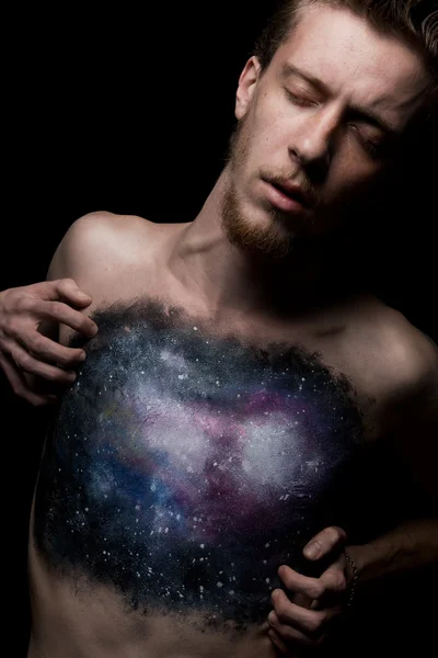 Studio shot fo creative body art. Closed eyes. Black background