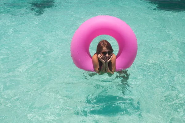 Young women relax in floating