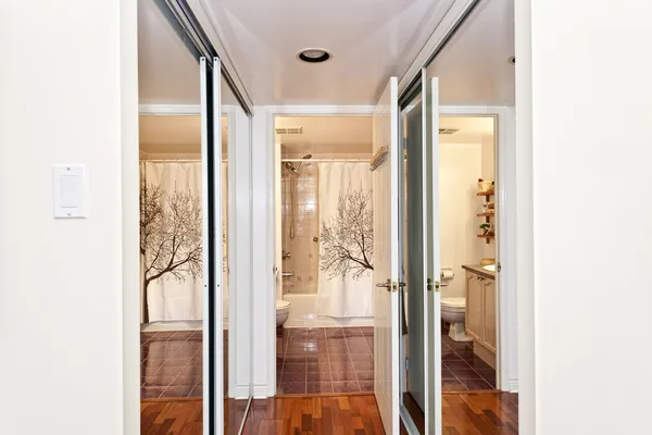 Mirrored closets and bathroom