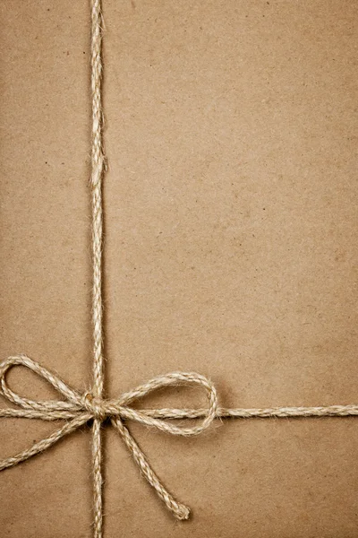 Package in brown paper tied with string