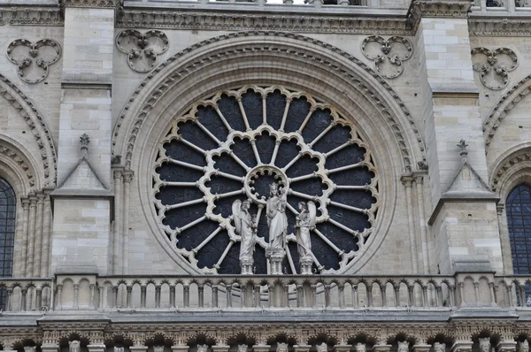 A rose window above the central portal of Notre-Dame, Paris, France