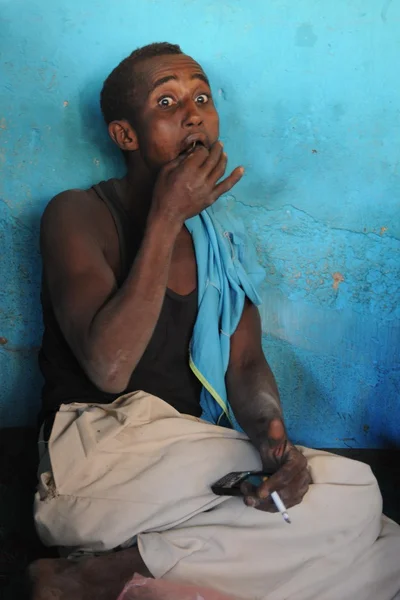 Men use Khat during a meeting in a cafe.