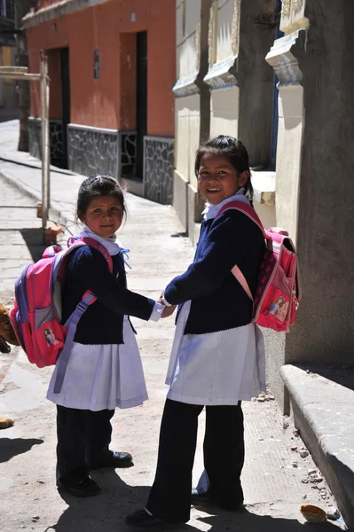 Unidentified girls on  street of Potosi.