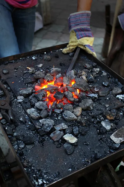 Detail metal working being worked at a blacksmith forge