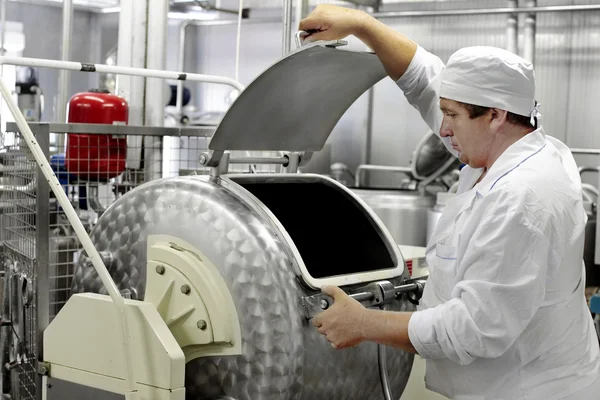 Worker on a milk factory