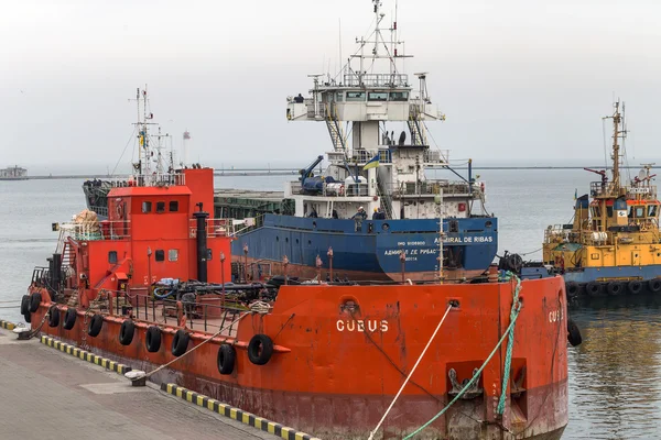 ODESSA, UKRAINE - 28 April: pilot tug towing a large sea cargo s