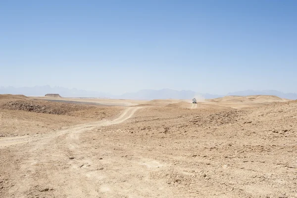 Travel on an empty desert landscape