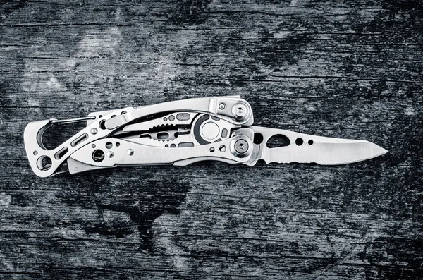 Multitool, multi purpose tool with plyers and knife color toned