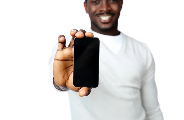 African man showing blank smartphone display