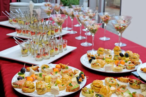 A lot of cold snacks on buffet table