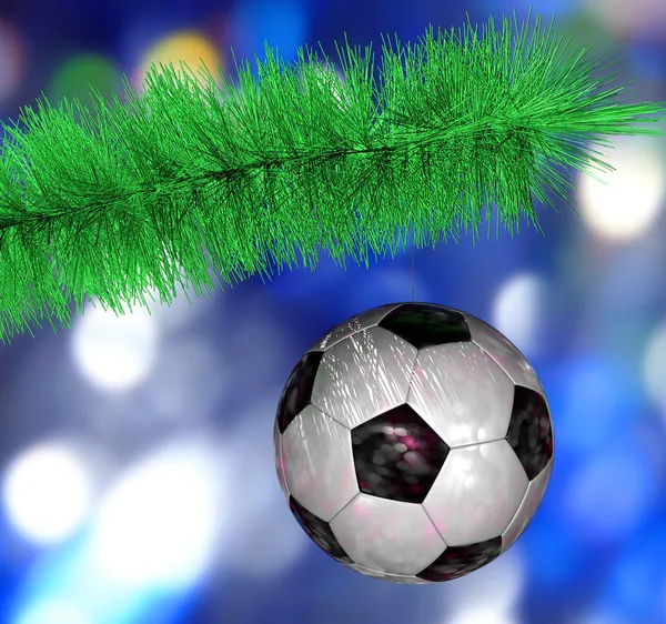 Soccer ball hanging on the Christmas tree branch