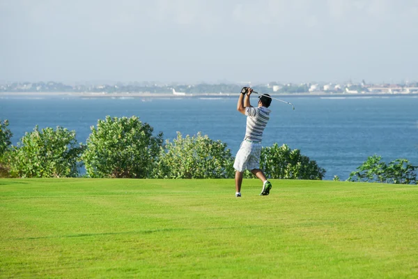 Golf club. Man playing golf