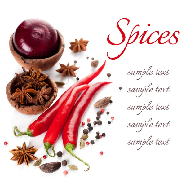 Red chili peppers and spices on a white background