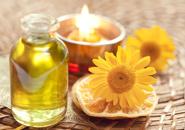 Essential oils for aromatherapy and yellow flowers