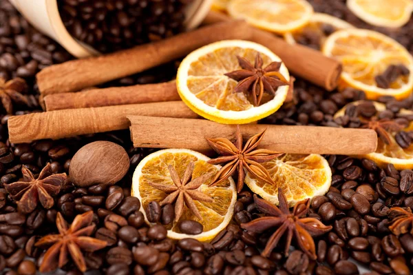 Coffee beans, cinnamon sticks, star anise and nutmeg