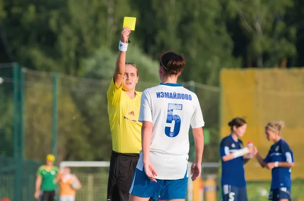 Referee shows a yellow card football players