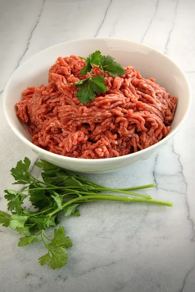 Close up of raw ground beef on cutting board