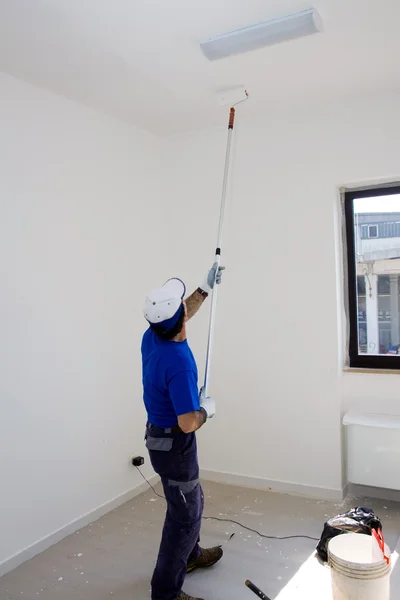 House painter painting ceiling