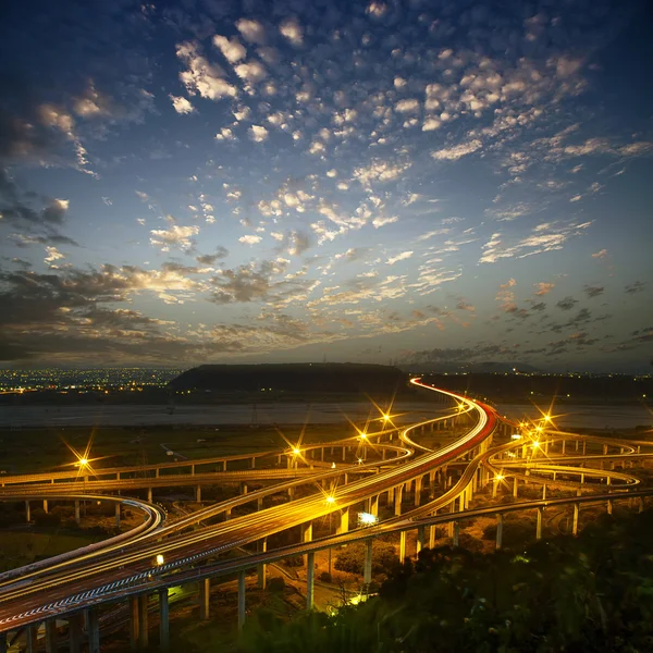 Highway in night with cars light