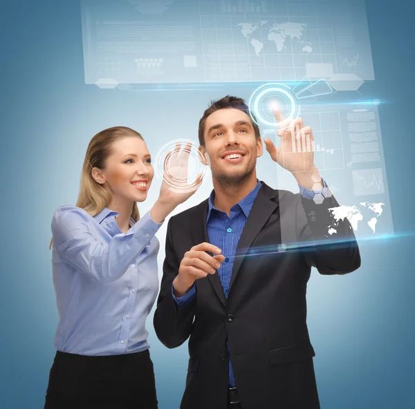 Man and woman working with virtual touch screens