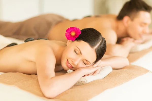 Couple in spa with hot stones