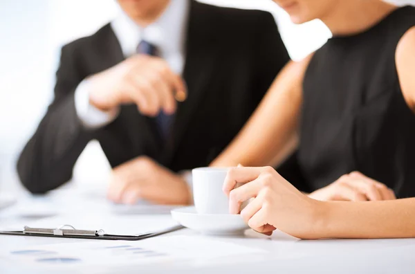 Woman hand signing contract paper