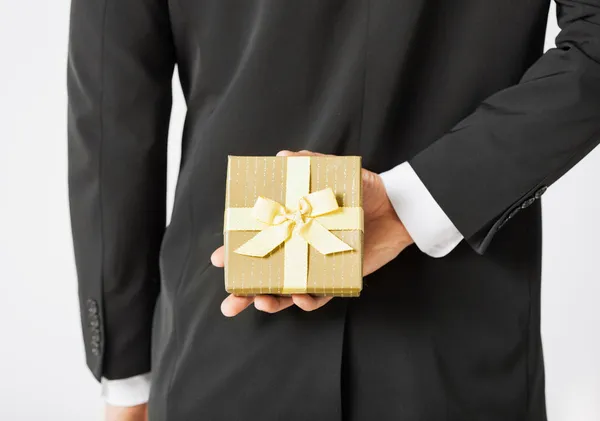 Man hands holding gift box