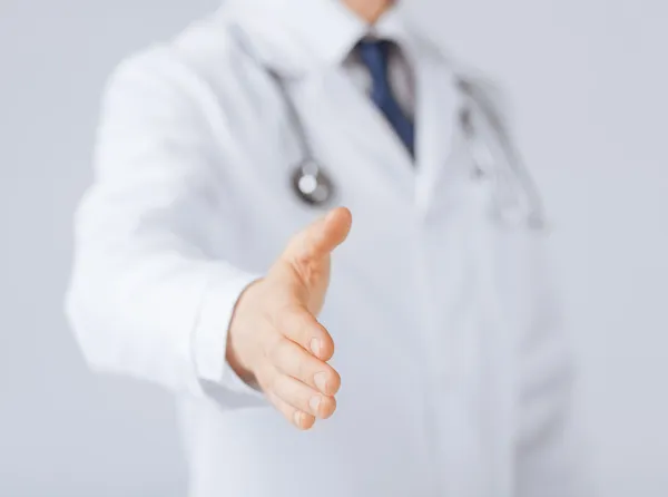Male doctor with open hand ready for hugging