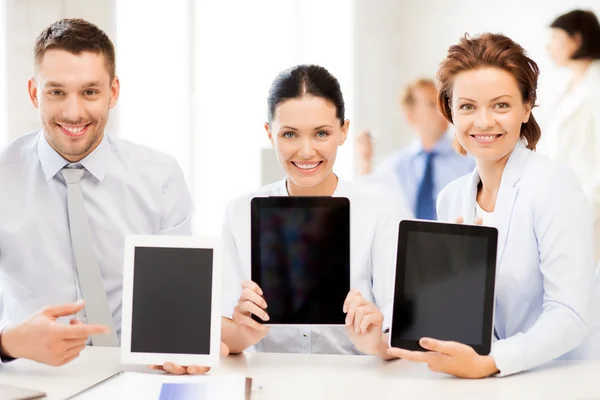 Business team showing tablet pcs in office