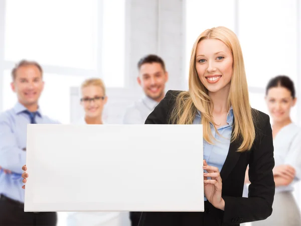 Businesswoman with white blank board