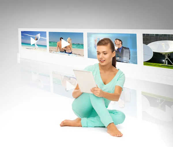 Woman with tablet pc and virtual screens