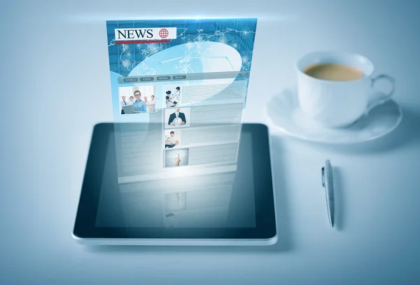 Stock Photo: Tablet pc with news feed