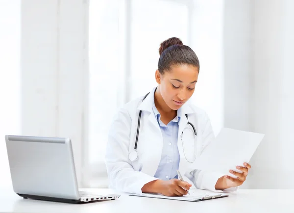 Female doctor with laptop pc