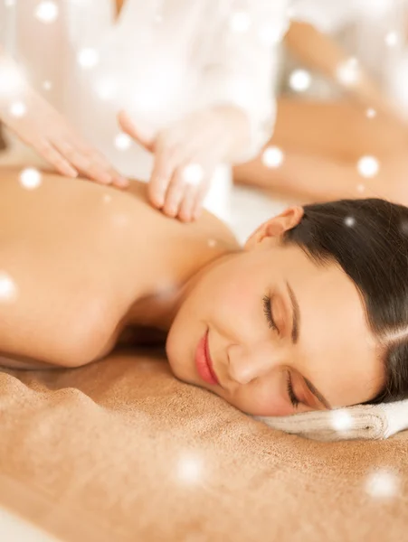 Woman in spa salon getting massage
