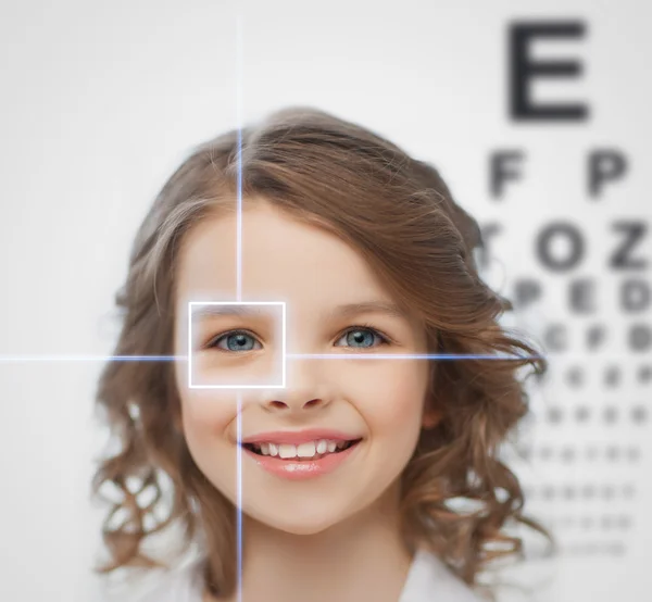 Girl with eyesight testing board