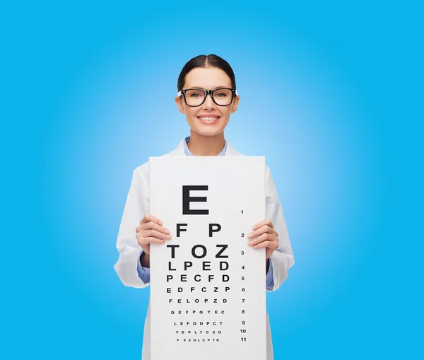 Female doctor in eyeglasses with eue chart