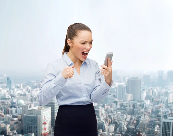 Screaming businesswoman with smartphone