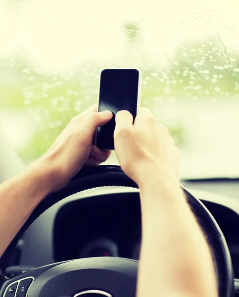 Man using phone while driving the car