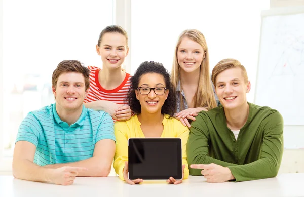 Smiling students showing tablet pc blank screen
