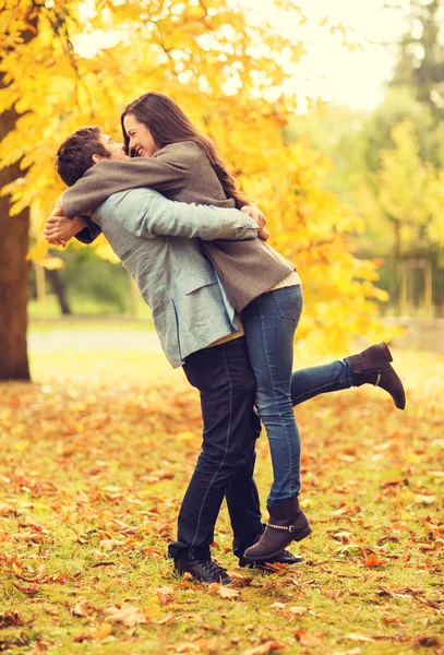 Romantic couple playing in the autumn park