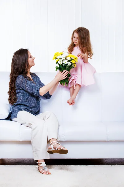 Mother with flowers and daughter