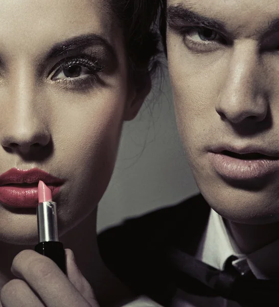 Portrait of a woman and man with lipstick — Stock Photo #23152298
