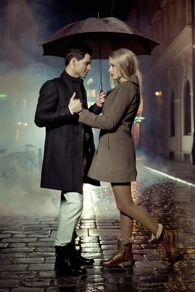 Picture presenting couple during autumn evening
