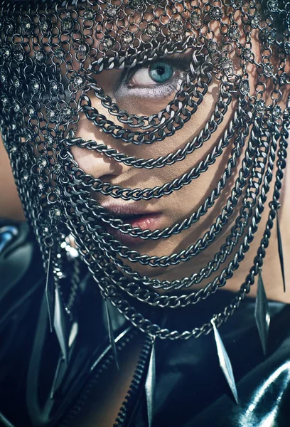 Young woman with chain mask