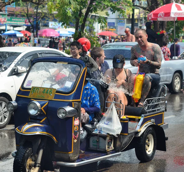 CHIANG MAI, THAILAND - APRIL 13 : Chiangmai Songkran festival.Unidentifi ed men and women traveler Like to join the fun with splashing water on 13 April 2014 in Chiang Mai, Thailand