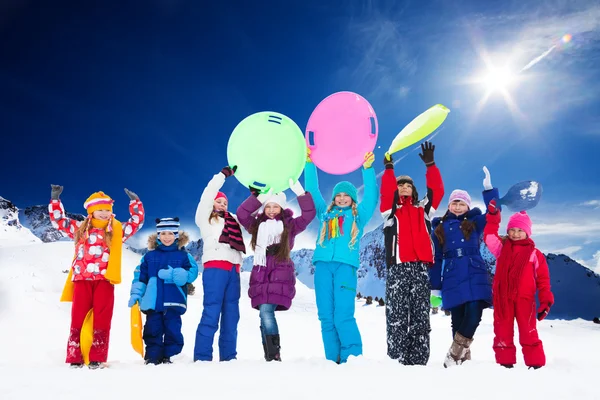 Many kids and snow activities