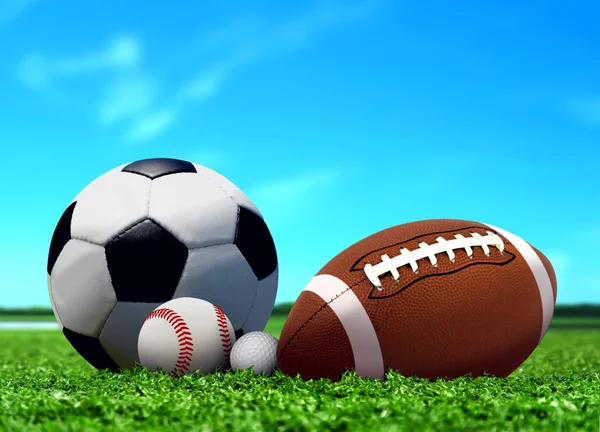 Sport Balls on Grass with Blue Sky