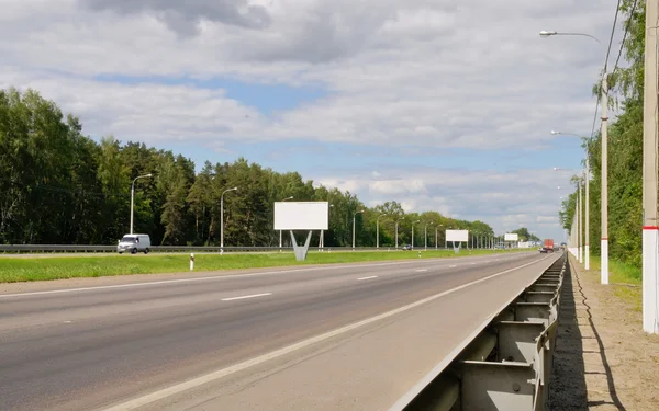Road with an asphalt covering and a dividing strip