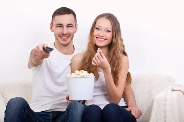 Young couple watching tv